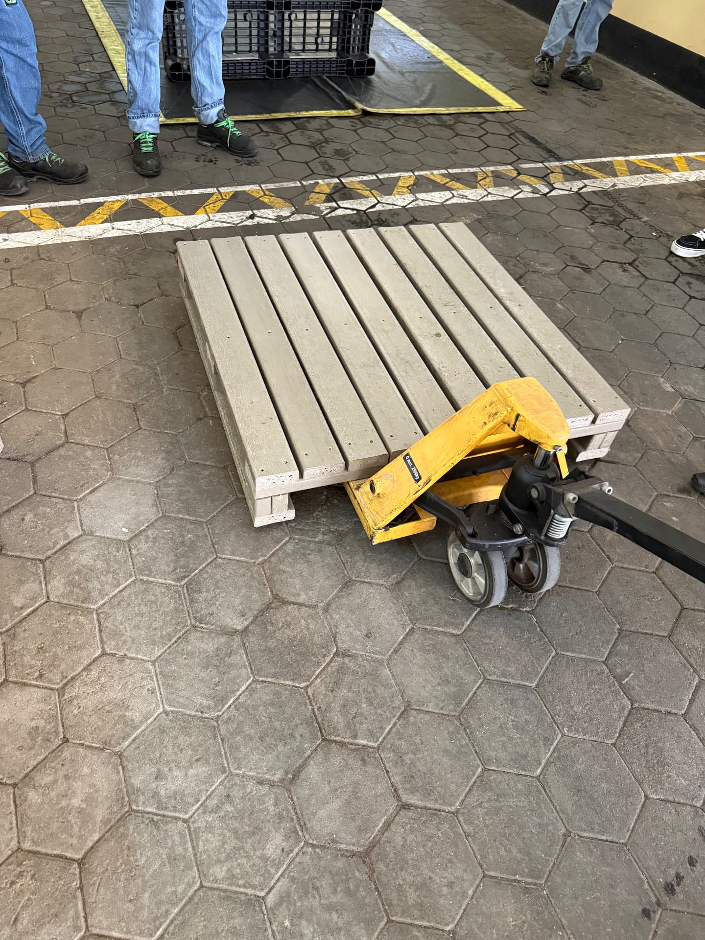 Recycled plastic shipping pallet on the factory floor