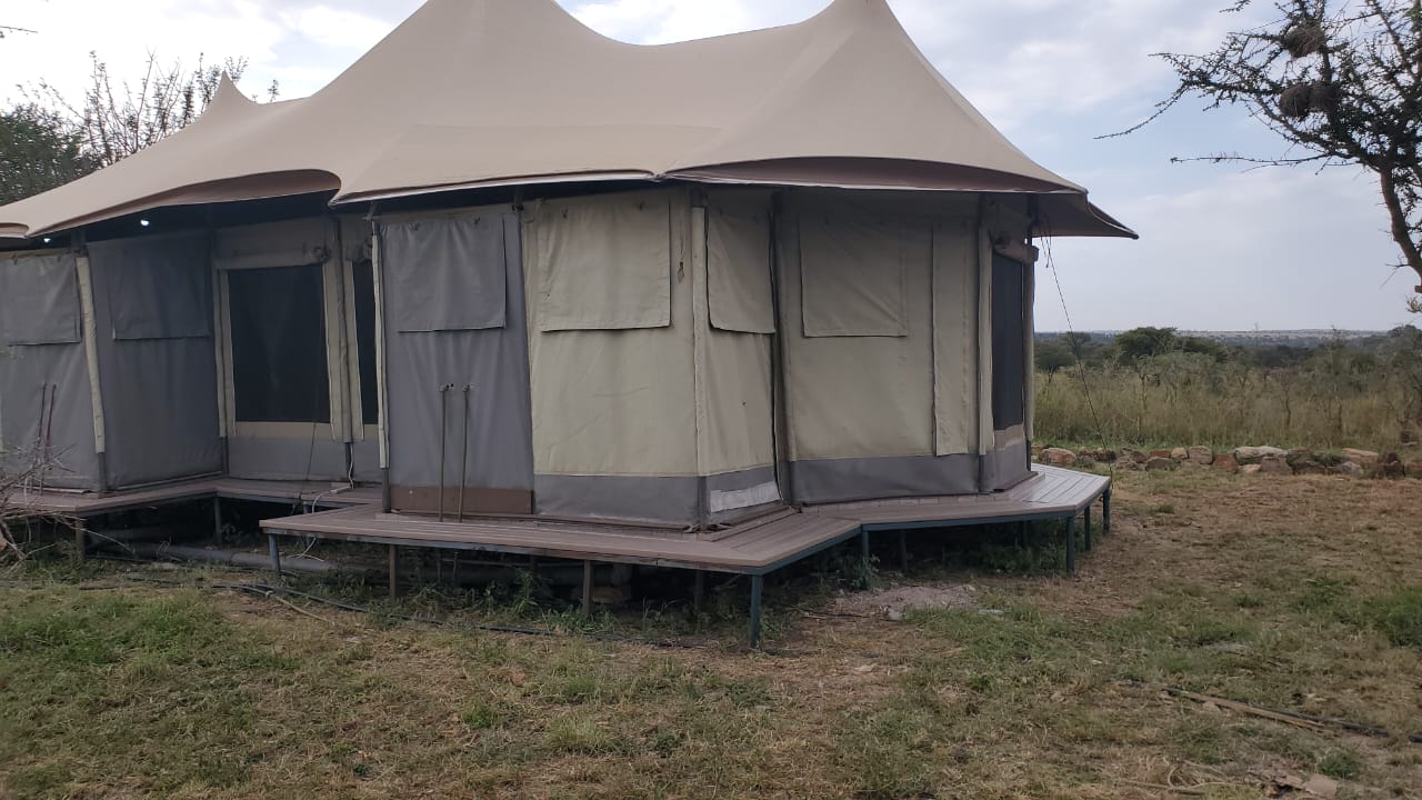 Recycled plastic deck platform serving a tented safari camp in Tanzania