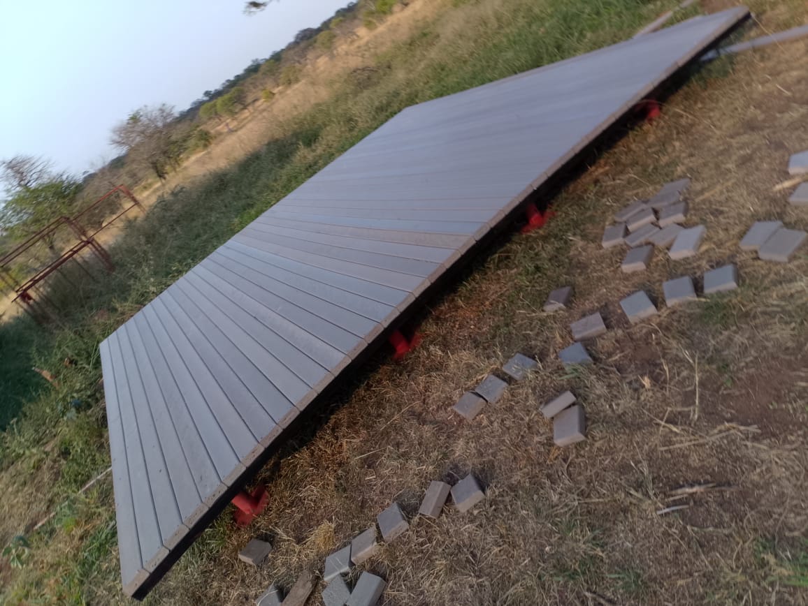 Recycled plastic deck with an integrated access ramp set into the bush landscape