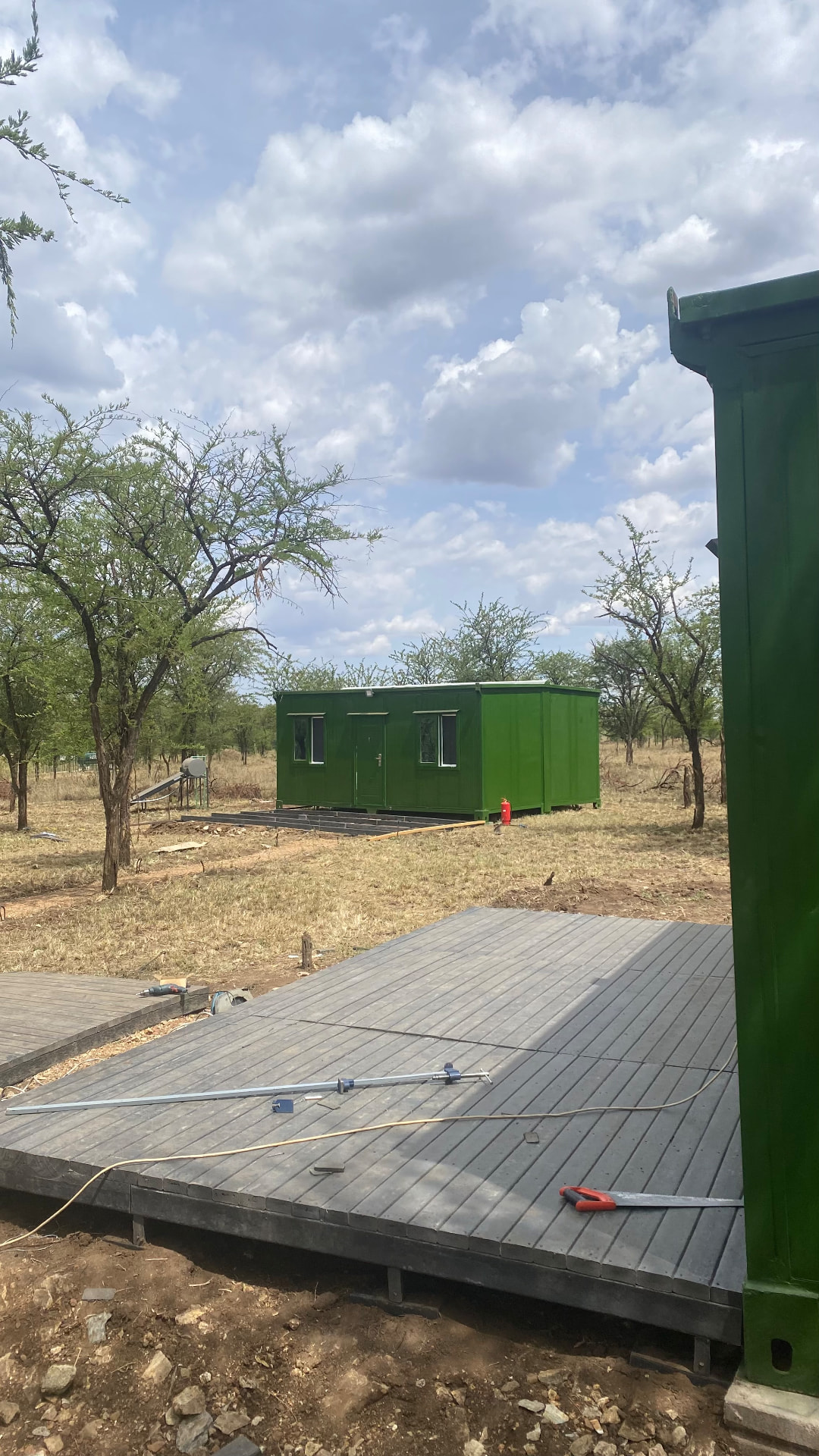Recycled plastic decks under construction between cabins at the Nyasa Balloon Safari base